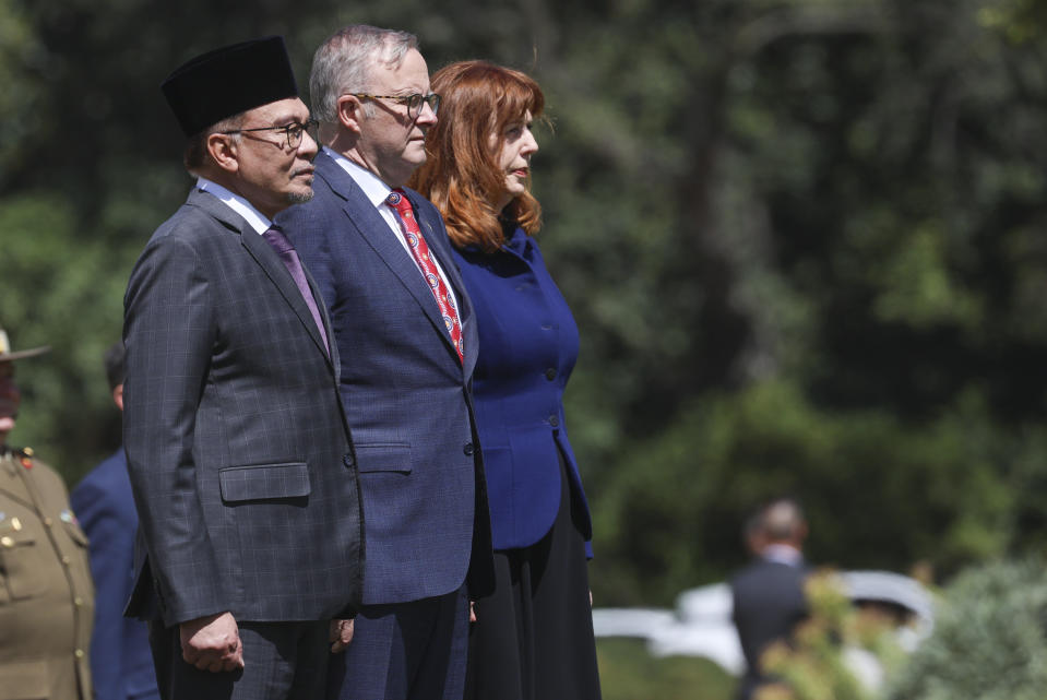 The Prime Minister of Malaysia Anwar Ibrahim, left, stands with Australian Prime Minister Anthony Albanese and the Governor of Victoria, Margaret Gardner, during a ceremonial welcome at Government House ahead of the ASEAN-Australia Special Summit in Melbourne, Australia, Monday, March 4, 2024. An increasingly assertive China and a humanitarian crisis in Myanmar are likely to be high on the agenda when Southeast Asian leaders meet in Australia for a rare summit March 4-6. (AP Photo/Hamish Blair)