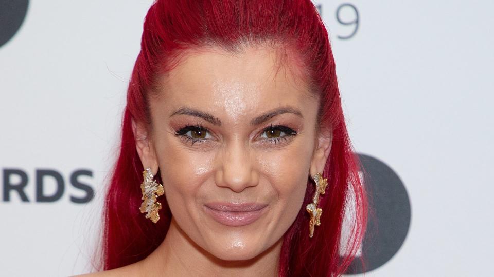 Dianne Buswell with a half-up-do on red carpet