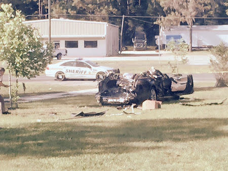 FILE PHOTO: A Tesla Model S involved in the fatal crash on May 7, 2016 is shown with the top third of the car sheared off, in the yard of Robert and Chrissy VanKavelaar in Williston, Florida, U.S. May 7, 2016. Courtesy Robert VanKavelaar/Handout via REUTERS