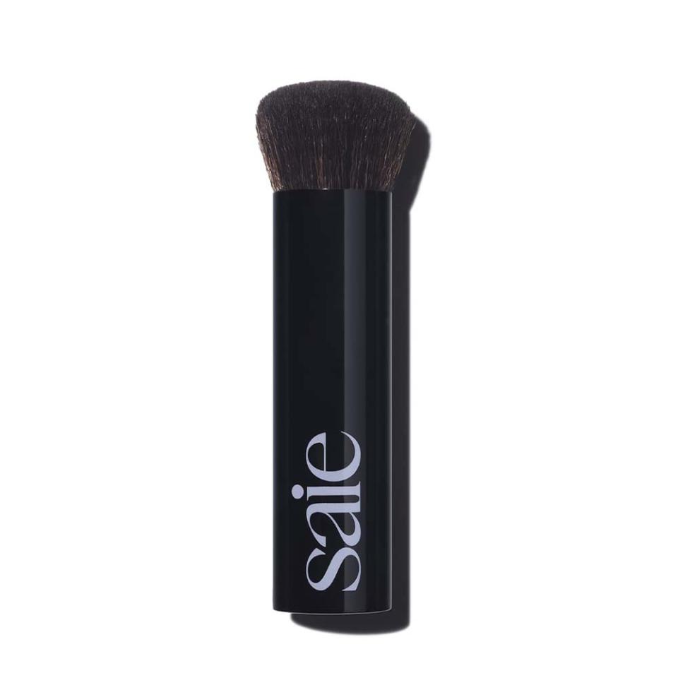 makeup brush with black handle
