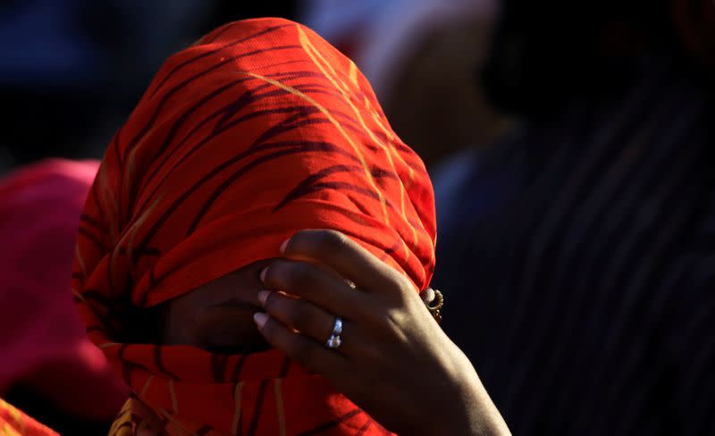 FILE PHOTO: An Ethiopian woman who fled the ongoing fighting in Tigray region, sits in Hamdayet village near the Sudan-Ethiopia border, eastern Kassala state