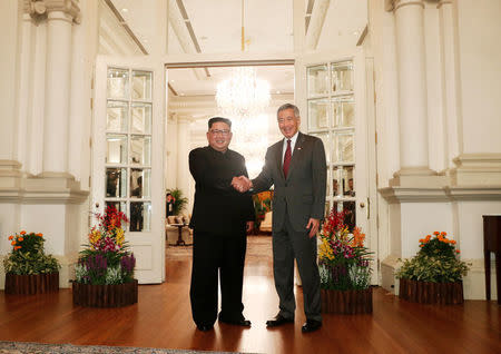 North Korea's leader Kim Jong Un shakes hands with Singapore's Prime Minister Lee Hsien Loong at the Istana in Singapore June 10, 2018. REUTERS/Edgar Su