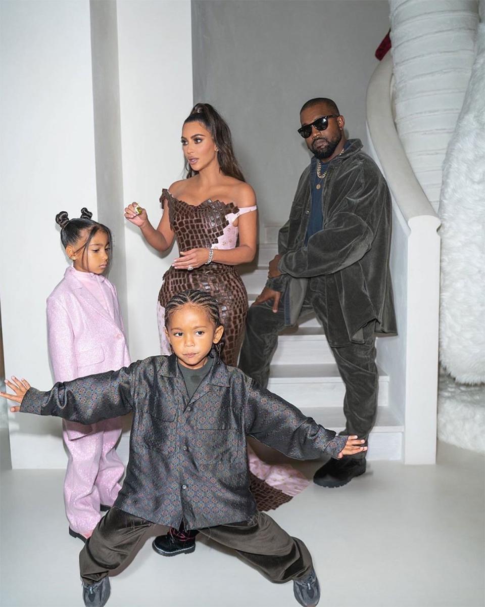 Saint West added a silk, button down shirt to his velvet 'fit. 