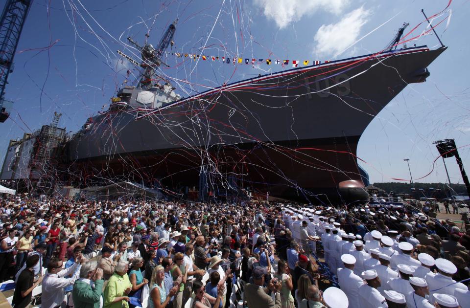 FILE - An Arleigh-Burke Class destroyer is christened at Bath Iron Works in Bath, Maine, Aug. 1, 2009. The U.S. Navy's workhorse destroyer went into production more than 30 years but will soon be replaced by a new destroyer that will feature lasers that can shoot down missiles and attack enemies with hypersonic missiles topping 3,800 mph. (AP Photo/Robert F. Bukaty, File)