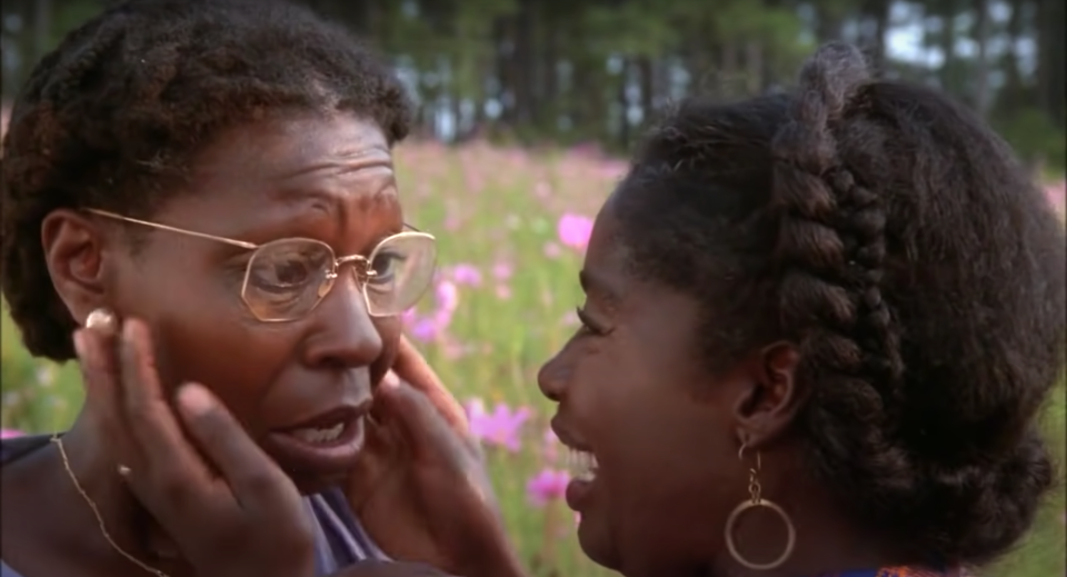 Two women hold each other in a lavender field