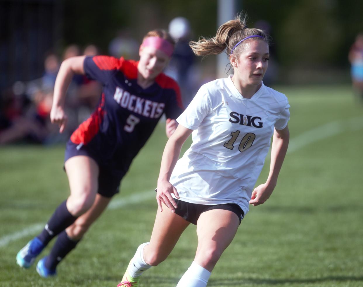 Sacred Heart-Griffin's Isabella Perryman advances the ball against Rochester during a Central State Eight Conference girls soccer match on Tuesday, April 9, 2024. SHG won 2-0.