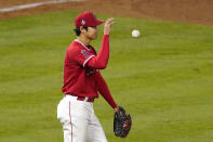 Los Angeles Angels starting pitcher Shohei Ohtani tosses the ball after walking Tampa Bay Rays' Joey Wendle during the sixth inning of a baseball game Wednesday, May 5, 2021, in Anaheim, Calif. (AP Photo/Mark J. Terrill)