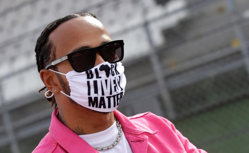 Lewis Hamilton wears a "Black Lives Matter" mask ahead of a 2020 race.