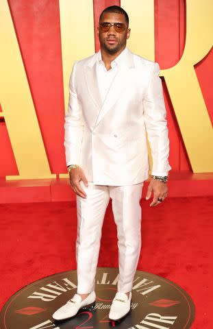 <p>Amy Sussman/Getty</p> Russell Wilson at the 2024 Vanity Fair Oscar Party
