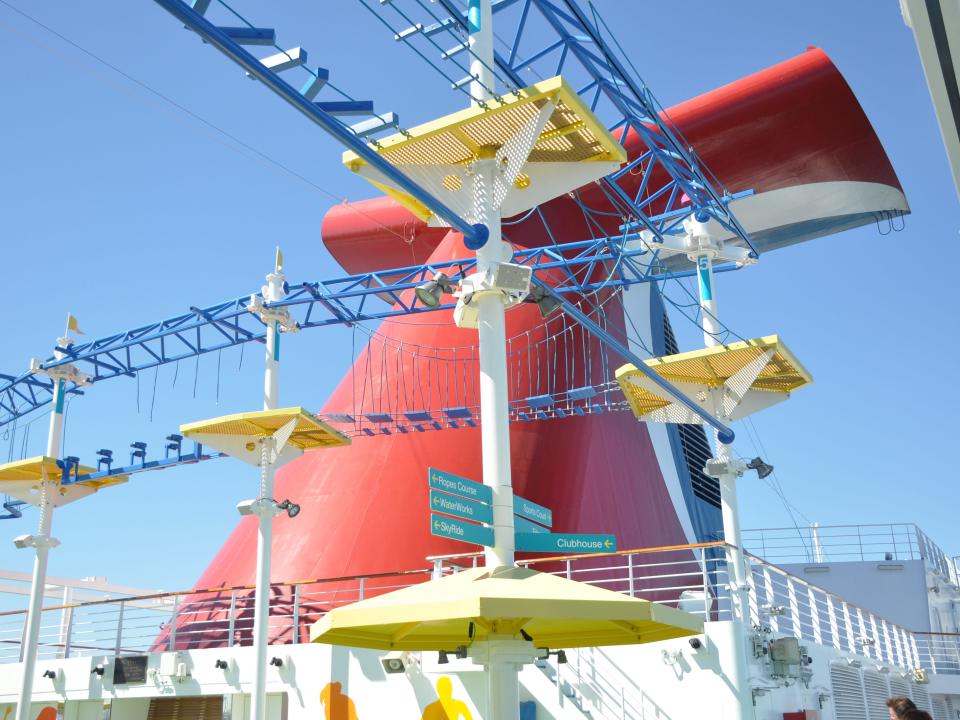 An aerial ropes course on the top of a Carnival cruise ship.