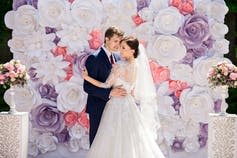 <span class="caption">People often regret getting married when young, just as they do with tattoos.</span> <span class="attribution"><a class="link " href="http://www.shutterstock.com/pic-467226644/stock-photo-wedding-wedding-day-paper-flowers-in-wedding-decor-bride-and-groom-on-wedding-ceremony-with-luxury-wedding-decoration-wedding-decoration-ceremony-beautiful-bride-and-elegant-groom-on.html?src=iQnpO7yzW2tlQDNi_khcLg-1-55" rel="nofollow noopener" target="_blank" data-ylk="slk:From www.shutterstock.com;elm:context_link;itc:0;sec:content-canvas">From www.shutterstock.com</a></span>