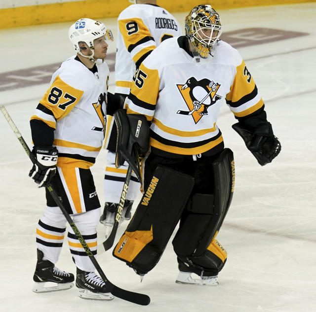 Pittsburgh Penguins center Sidney Crosby and goaltender Tristan Jarry skate off the ice after losing to the New York Rangers in overtime of Game 7 in an NHL hockey playoff series, Sunday, May 15, 2022, at Madison Square Garden in New York. (Matt Freed/Pittsburgh Post-Gazette via AP)