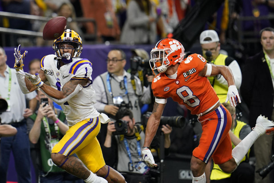 LSU wide receiver Ja'Marr Chase catches a touchdown pass in front of Clemson cornerback A.J. Terrell during the first half of a NCAA College Football Playoff national championship game Monday, Jan. 13, 2020, in New Orleans. (AP Photo/David J. Phillip)