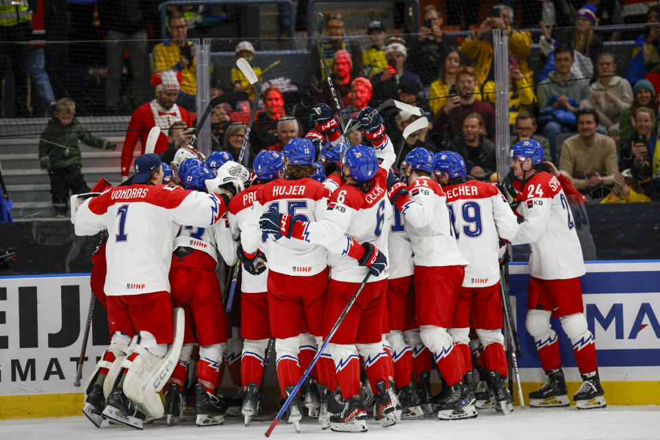 Czech Republic's celebrate winning the IIHF World Junior Championship ice hockey quarterfinal match between Canada and Czech Republic at Scandinavium in Gothenburg, Sweden, Tuesday, Jan. 2, 2024. (Adam Ihse/TT News Agency via AP)