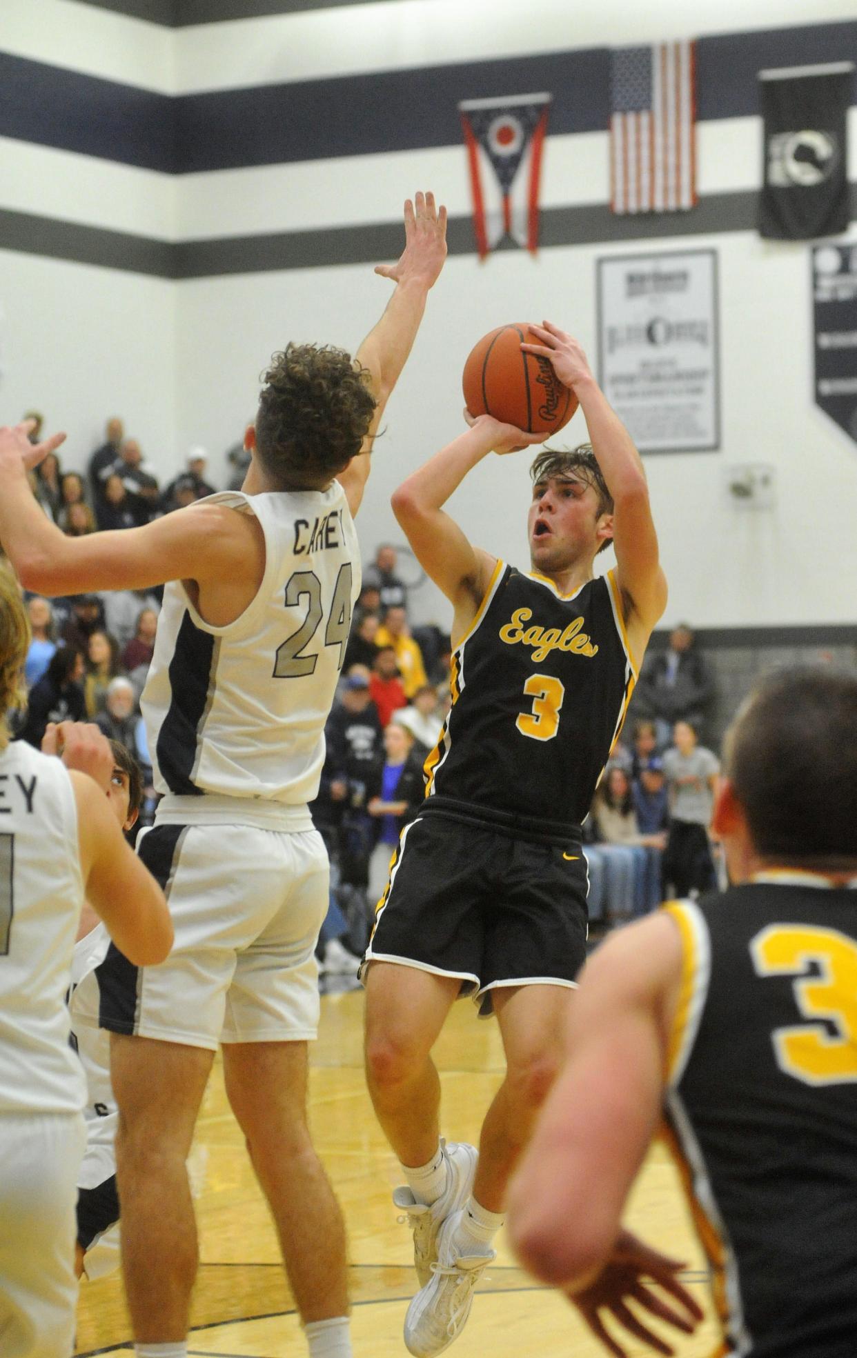 Colonel Crawford's Derek Horsley shoots over Carey's Brayden Young.