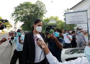 Reigning Mrs World Caroline Jurie leaves the police station in Colombo