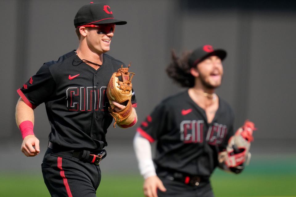Cincinnati Reds shortstop Matt McLain (9) smiles as he jogs after throwing to first base to end the top of the second inning during a baseball game between the San Diego Padres and the Cincinnati Reds, Friday, June 30, 2023, at Great American Ball Park in Cincinnati. 