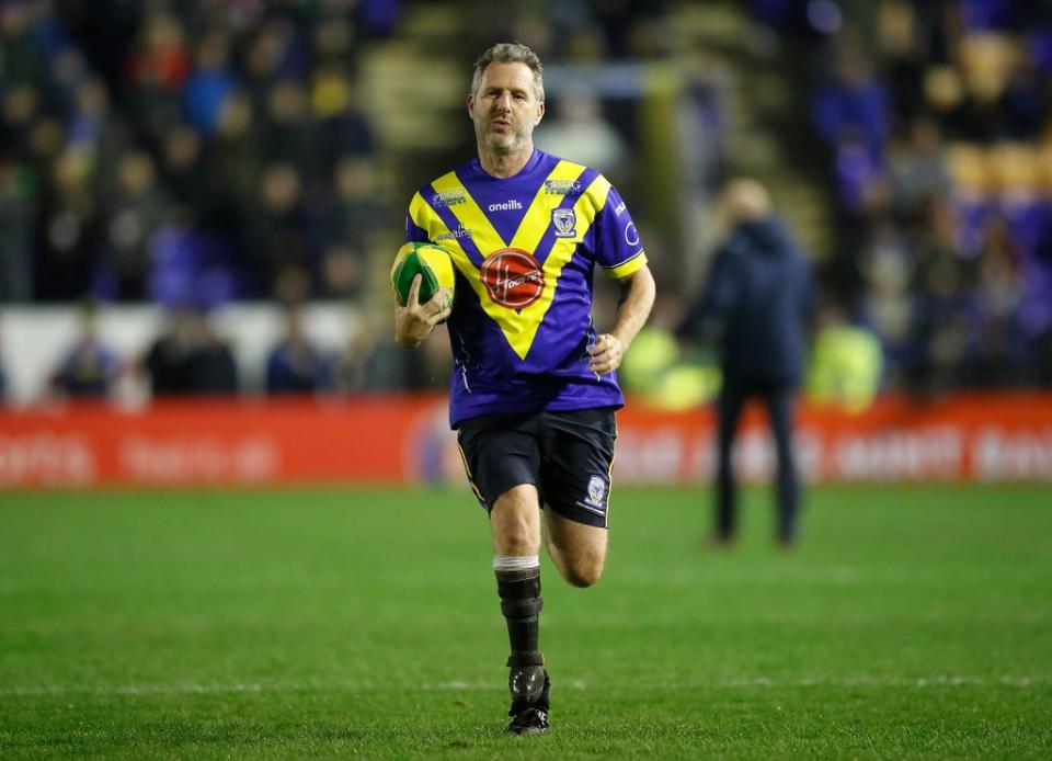 Adam Hills playing in a SuperLeague match (PA) (PA Archive)
