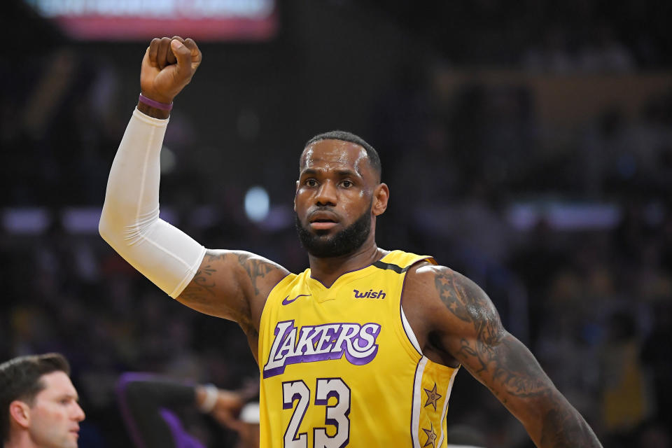 Los Angeles Lakers forward LeBron James celebrates after scoring during the first half of the team's NBA basketball game against the New Orleans Pelicans on Friday, Jan. 3, 2020, in Los Angeles. (AP Photo/Mark J. Terrill)