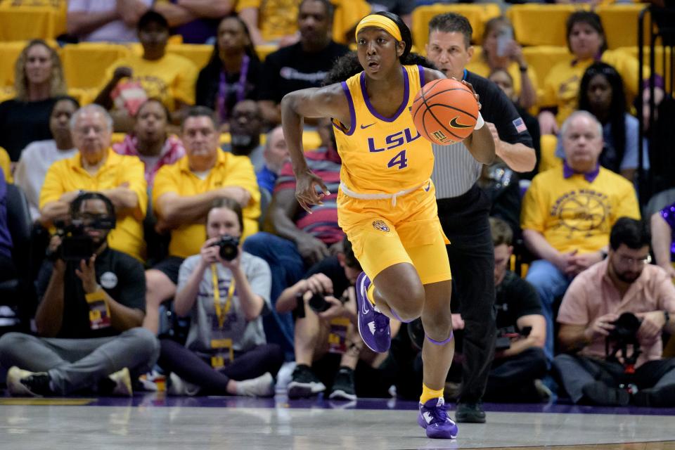 LSU guard Flau'jae Johnson (4) dribbles in the first half of an NCAA basketball game Sunday, Feb. 26, 2023, in Baton Rouge, La. (AP Photo/Matthew Hinton)