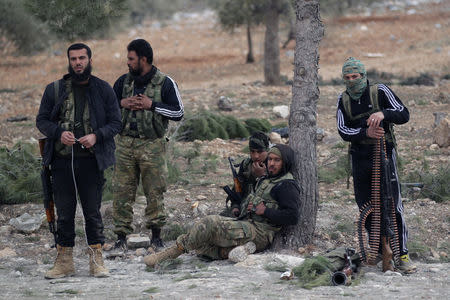 Free Syrian Army fighters rest on the outskirts of the Islamic State-controlled northern Syrian town of al-Bab, Syria February 4, 2017. Picture taken February 4, 2017. REUTERS/Khalil Ashawi