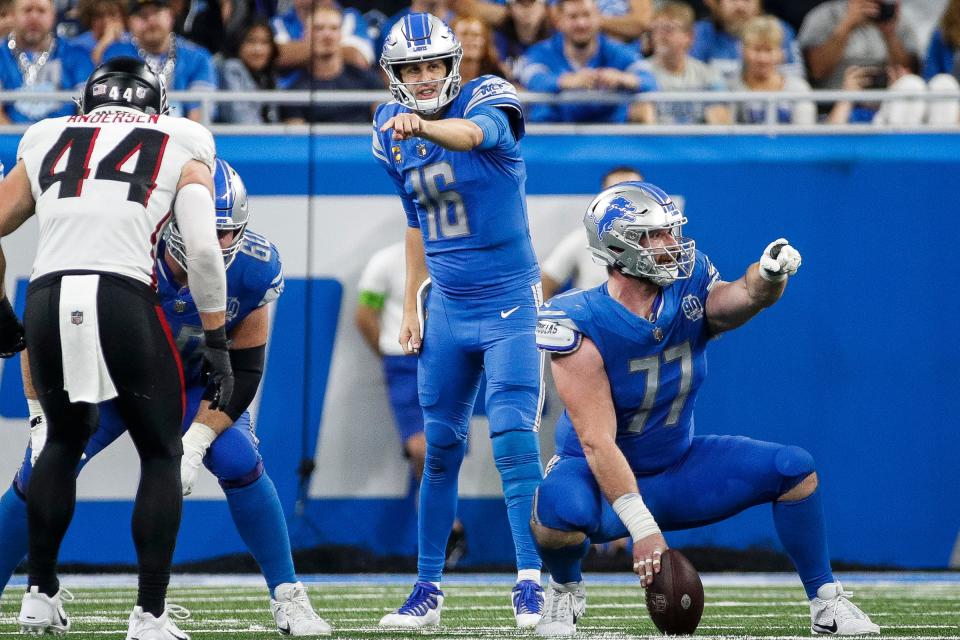 Detroit Lions quarterback Jared Goff (16) talks to center Frank Ragnow (77) before a snap against Atlanta Falcons during the second half at Ford Field in Detroit on Sunday, Sept. 24, 2023.