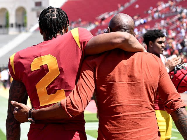 <p>Jayne Kamin-Oncea/Getty</p> Jerry Rice with his son, Brenden Rice of the USC Trojans, following the spring football game at the Los Angeles Memorial Coliseum on April 15, 2023