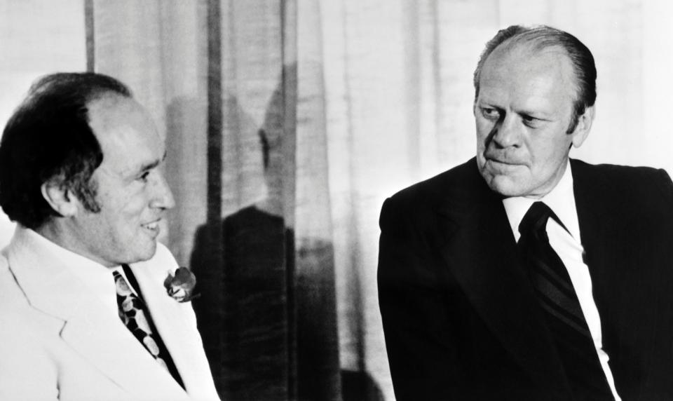 U.S. President Gerald Ford speaks with Canadian Prime Minister Pierre Trudeau during the NATO 1975 summit in Brussels. (Credit: AFP via Getty Images)