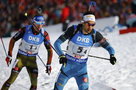 Biathlon - IBU World Championships - Men 4 x 7.5 km Relay - Hochfilzen, Austria - 18/2/17 - Martin Fourcade of France and Simon Schempp of Germany in action. REUTERS/Leonhard Foeger