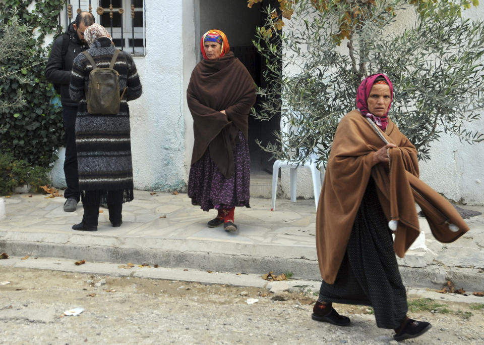 Villagers leave Anis Amri's parents house after presenting their condolences in Oueslatia, central Tunisia, Friday, Dec. 23, 2016. Anis Amri, the Tunisian-born suspect in the Berlin truck rampage that killed at least 12, was shot dead early Friday in the outskirts of Milan, Italy. (AP Photo/Anis Ben Salah)