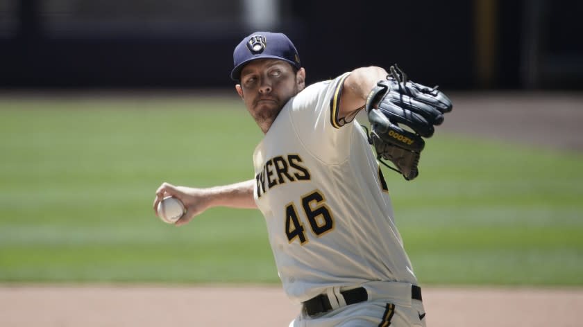 Milwaukee Brewers' Corey Knebel throws during a practice session Monday, July 13, 2020, at Miller Park in Milwaukee. (AP Photo/Morry Gash)