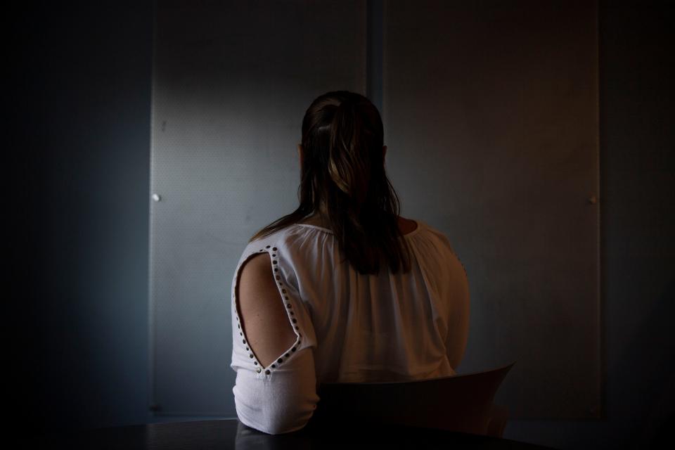 A woman, who is suing over her lifelong classification as a violent sexual offender despite never being convicted of a sexual offense, sits at her attorney's office in Nashville, Tenn., on Wednesday, Oct. 18, 2023.