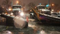 Snow plows prepare to clear slushy streets in Toronto on Monday as forecasters warn freezing rain will turn roads in much of Southern Ontario into ice paths.