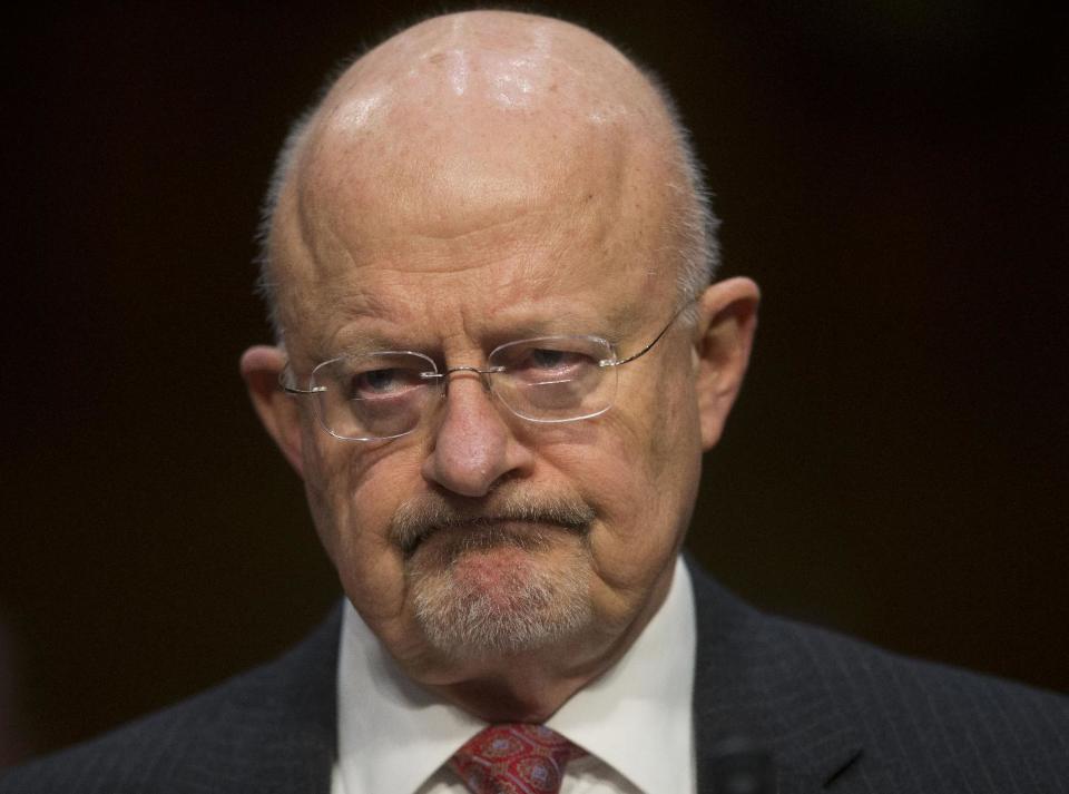 Director of National Intelligence James Clapper listens as he testifies on Capitol Hill in Washington, Wednesday, Jan. 29, 2014, before the Senate Intelligence Committee hearing on current and projected national security threats against the US. (AP Photo/Pablo Martinez Monsivais)