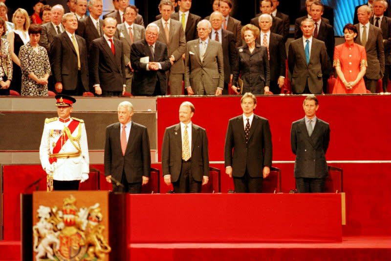 Among the personalities attending the handover of Hong Kong to China, June 30, 1997, were (front R to L) Prince Charles, Prime Minister Tony Blair, Foreign Secretary Robin Cook and Hong Kong Governor Chris Patten. Former Prime Minister Margaret Thatcher and her husband Dennis were in the back row. UPI File Photo