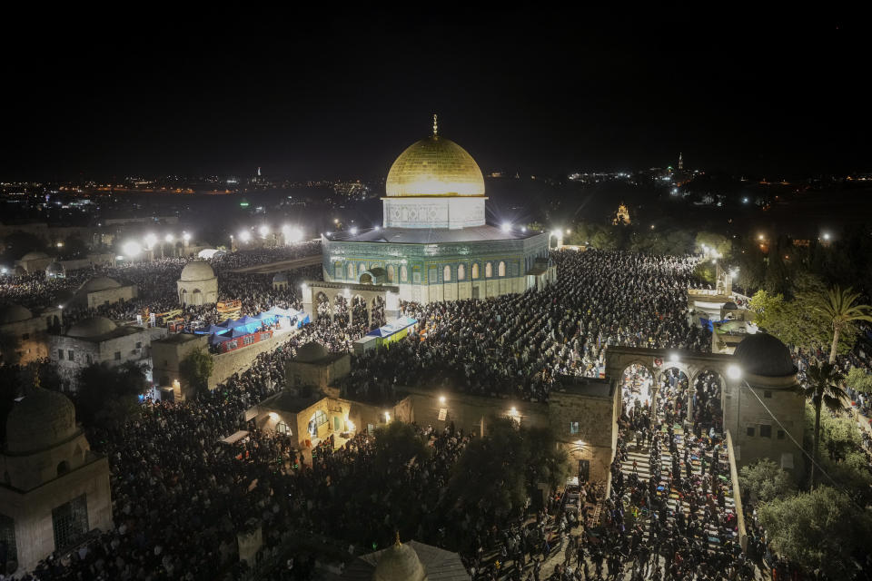 Palestinian Muslim worshippers pray during Laylat Al Qadr, also known as the Night of Destiny, in front of the Dome of the Rock, in the Al Aqsa Mosque compound in Jerusalem's Old City, Monday, April 17, 2023. Laylat Al Qadr is marked on the 27th day of the holy fasting month of Ramadan and is commemorated as the night Prophet Muhammad received the first revelation of the Quran. Muslims traditionally spend the night in prayer and devotion. (AP Photo/Mahmoud Illean)