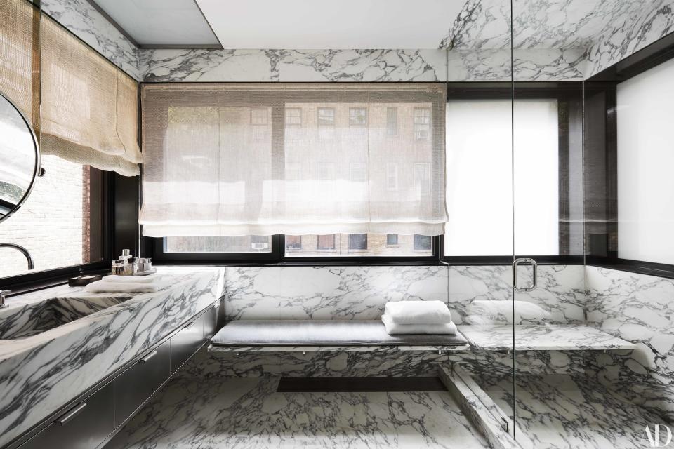 Arabescato Cervaiole marble covers Warren's master bath, where the sink fittings are by Dornbracht