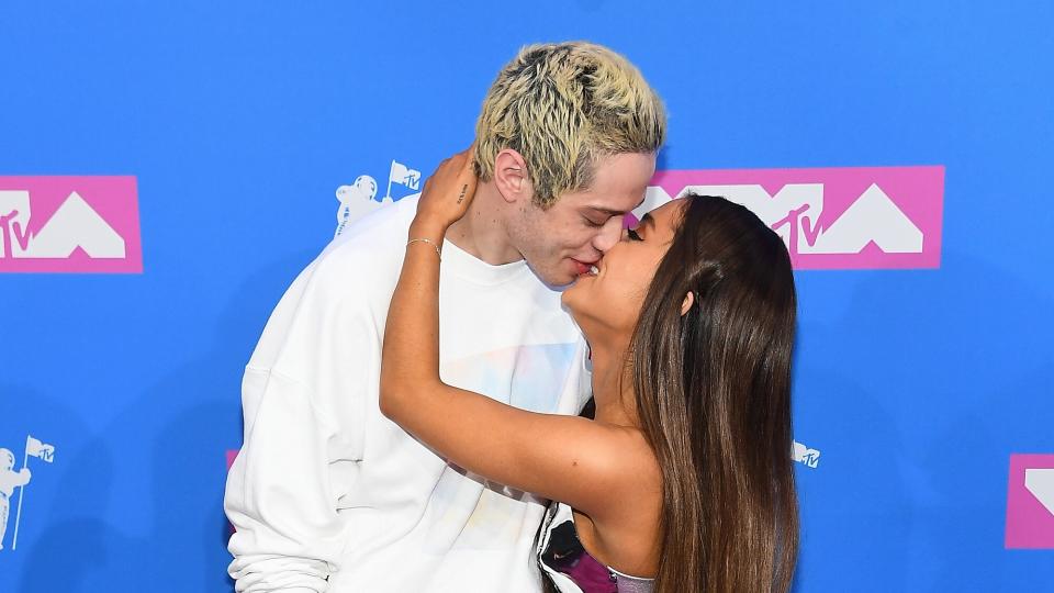 Pete Davidson and Ariana Grande kiss as they attends the 2018 MTV Video Music Awards at Radio City Music Hall on August 20, 2018 in New York City.