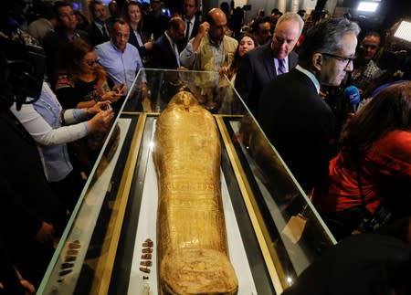 US Charge d'Affaires in Cairo Thomas Goldberger looks at the Gold Coffin of Nedjemankh during a news conference to announce its return from the U.S. and display at the National Museum of Egyptian Civilization (NMEC) in Cairo