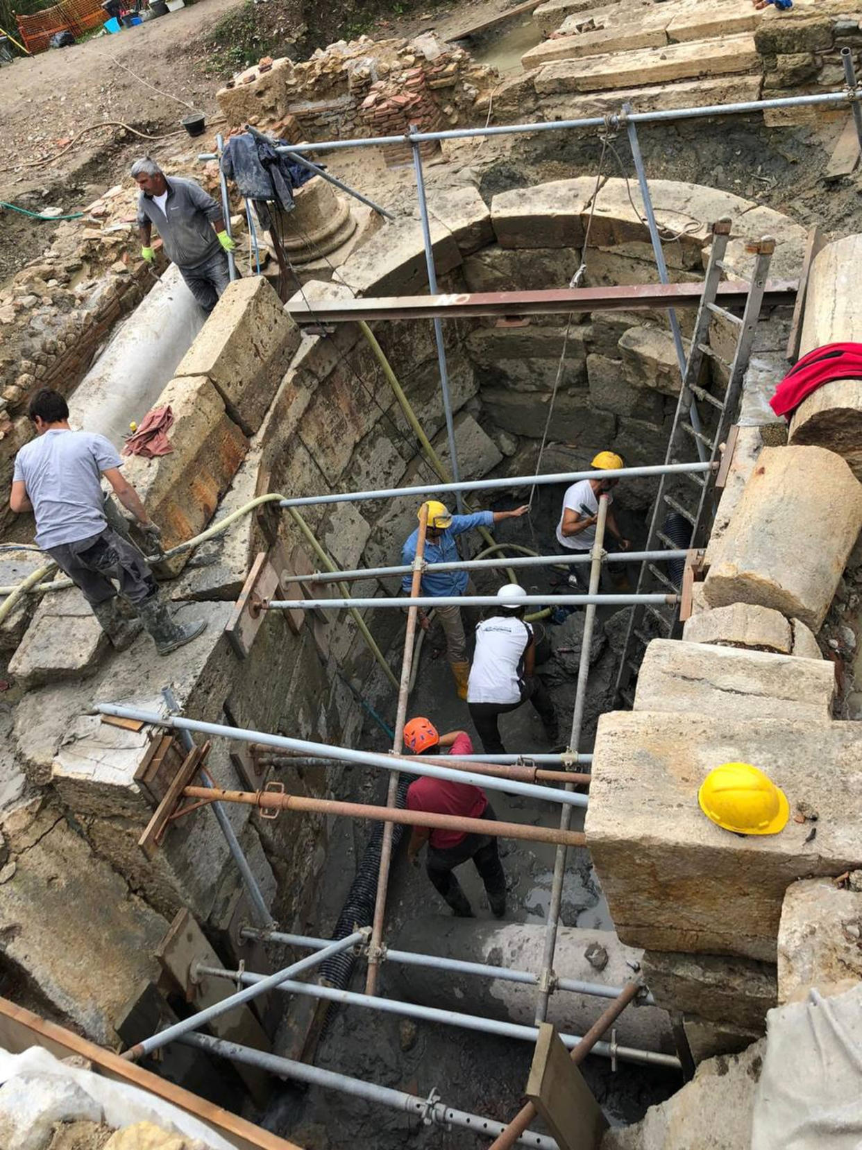 Archaeologists work at the site of the discovery of two dozen well-preserved bronze statues from an ancient Tuscan thermal spring in San Casciano dei Bagni, central Italy, in this update photo made available by the Italian Culture Ministry, Thursday, Nov. 3, 2022. (Italian Culture Ministry via AP)