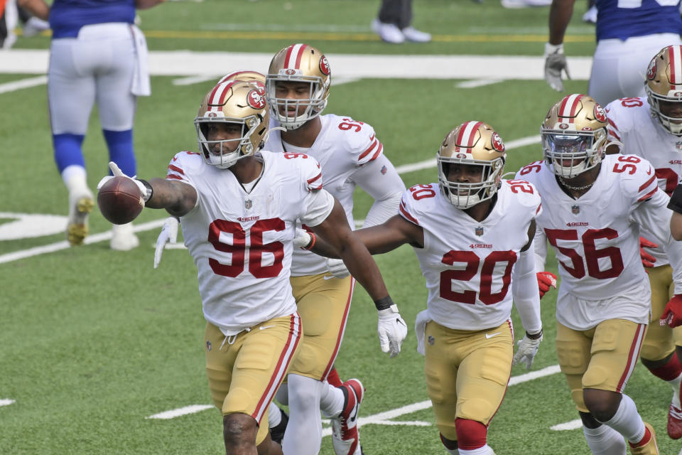 San Francisco 49ers' Dion Jordan (96) celebrates a turnover with teammates during the first half of an NFL football game against the New York Giants, Sunday, Sept. 27, 2020, in East Rutherford, N.J. (AP Photo/Bill Kostroun)