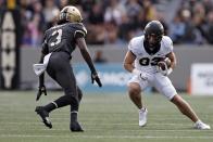 Wake Forest wide receiver Taylor Morin (83) runs around Army cornerback Julian McDuffie (3) during the first half of an NCAA college football game Saturday, Oct. 23, 2021, in West Point, N.Y. (AP Photo/Adam Hunger)