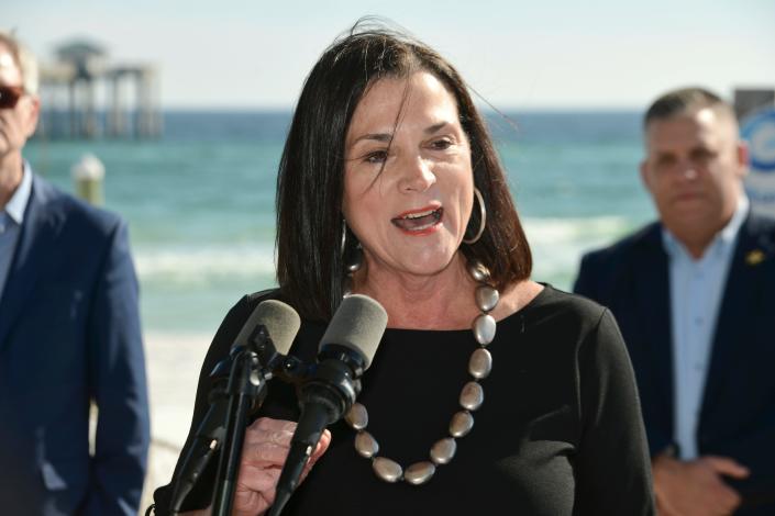 Dana Young, president and CEO of Visit Florida, touts the state&#39;s tourism numbers for last year during a press conference by Gov. Ron DeSantis on Tuesday at the Gulfarium Marine Adventure Park.