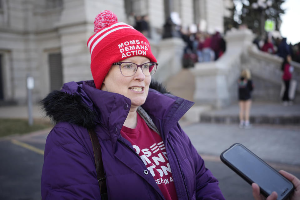 Rachel barnes, a teacher in the Denver Public Schools, talks as students and parents from schools across Colorado take part in a rally calling for state lawmakers to consider gun control measures during the current legislative session Friday, March 24, 2023, outside the State Capitol in Denver. (AP Photo/David Zalubowski)