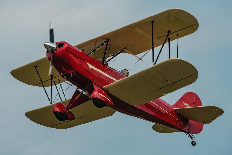 Cooper Winters, 12, (seated in front) flies in the Hatz biplane owned and operated by instructor Ryan Newell (in the rear seat) on Saturday at  Harry Clever Field. Winters was among 14 middle school students who completed the nine-week Wright Flight course offered by Chapter 1077 of the Experimental Aircraft Association.