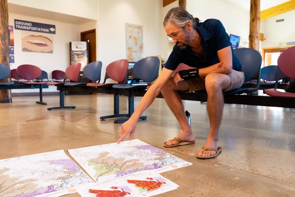 Neal Clark, wildlands director for the Southern Utah Wildlife Alliance, points at one of the proposed maps for the Labyrinth Canyon and Gemini Bridges Travel Plan at the Canyonlands Field Airport in Moab on Friday, Sept. 22, 2023. | Megan Nielsen, Deseret News
