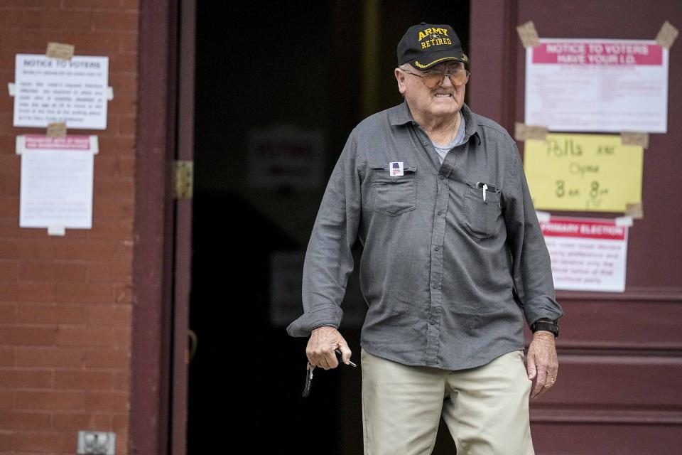 A voter exits the Seale Courthouse election area in Russell County during a primary election, Tuesday, March 5, 2024, in Seale, Ala. Fifteen states and a U.S. territory hold their 2024 nominating contests on Super Tuesday this year. (AP Photo/Mike Stewart)