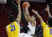 North Carolina State's Shakeel Moore (2) shoots during the first half of an NCAA college basketball game in Raleigh, N.C., Sunday, Feb. 28, 2021. (Ethan Hyman/The News & Observer via AP)