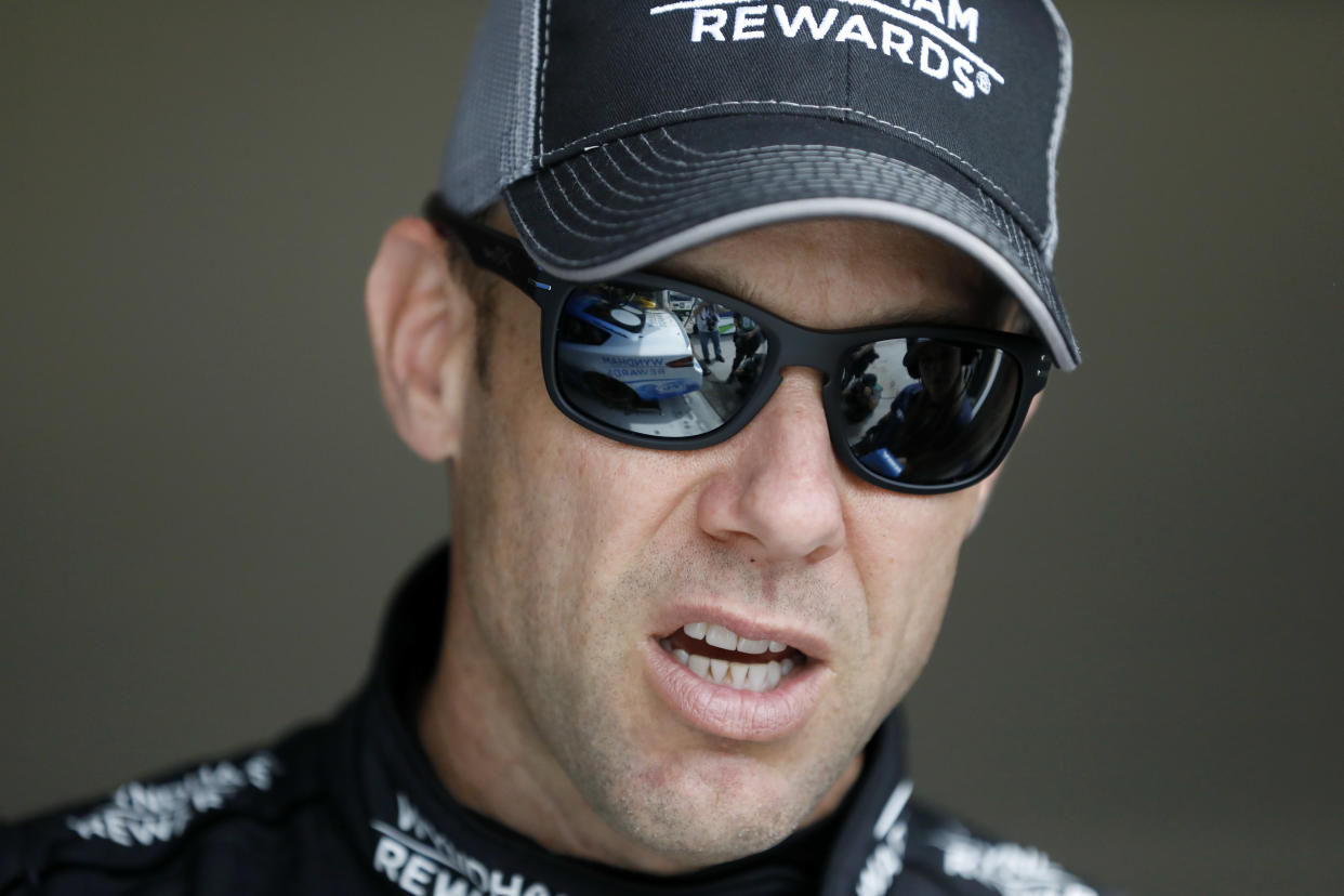 Driver Matt Kenseth stands in the garage area before a practice run for this weekend’s NASCAR Cup Series auto race at Kansas Speedway Friday, May 11, 2018, in Kansas City, Kan. (AP Photo/Colin E. Braley)