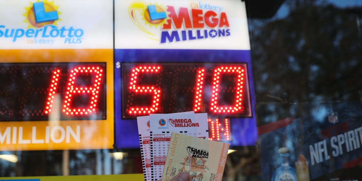 Mega Millions sing and lottery tickets are seen at a store in Burlingame, California, United States on December 23, 2022. Today's Mega Millions jackpot hits $510 million.